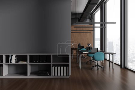 Dark office interior with chairs and table in row. Learning or coworking space, business room with laptop and panoramic window on Paris. Shelf with documents and mockup empty wall. 3D rendering