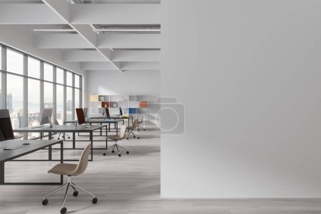 Photo for Interior of modern open space office with white walls, wooden floor, massive computer desks with beige chairs and colorful bookshelves. Copy space wall on the right. 3d rendering - Royalty Free Image
