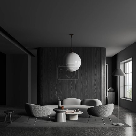 Foto de Interior de la elegante sala de estar con paredes de madera gris y oscura, suelo de hormigón, sofá acogedor y dos sillones de pie en la alfombra cerca de dos mesas de café redondas. renderizado 3d - Imagen libre de derechos