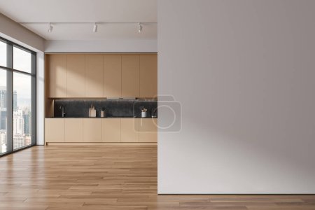 Téléchargez les photos : Élégant intérieur de cuisine d'hôtel avec armoire et ustensiles de cuisine, parquet. Espace de cuisson beige dans un appartement moderne avec fenêtre panoramique sur Kuala Lumpur. Cloison de mur de maquette. rendu 3D - en image libre de droit