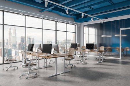 Photo for White and blue office loft interior with coworking and frosted glass meeting room, side view pc computers on desk and chairs in row. Panoramic window on Kuala Lumpur skyscrapers. 3D rendering - Royalty Free Image