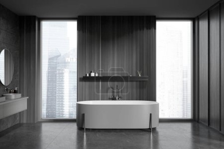 Foto de Elegante cuarto de baño interior oscuro con lavabo y bañera, estante y accesorios, suelo de baldosas grises y ventana panorámica de los rascacielos de Singapur. Renderizado 3D - Imagen libre de derechos