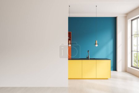 Téléchargez les photos : Intérieur de la cuisine moderne avec des murs blancs et bleu vif, sol en béton, île jaune vif avec évier intégré et mur maquette sur la gauche. Rendu 3d - en image libre de droit