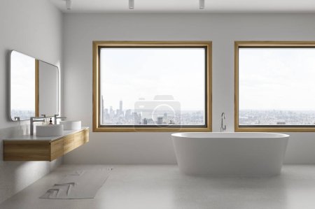 Téléchargez les photos : Élégant intérieur de salle de bain d'hôtel avec double lavabo et vanité, baignoire avec accessoires élégants. Deux lavabos et une fenêtre panoramique sur les gratte-ciel de New York. rendu 3D - en image libre de droit