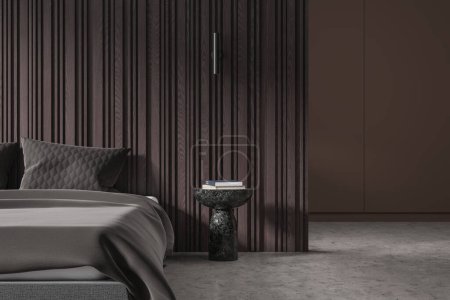 Téléchargez les photos : Chambre d'hôtel de luxe intérieur avec lit et table de chevet avec livres, cloison murale accentuée au sol en béton gris. Chambre à coucher avec design élégant et mobilier minimaliste. rendu 3D - en image libre de droit