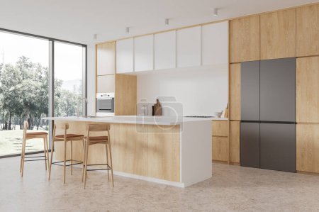 Photo for Interior of stylish kitchen with white walls, concrete floor, cozy white cupboards, wooden cabinets, comfortable white and wooden island with stools and fridge. 3d rendering - Royalty Free Image