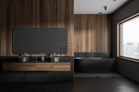 Photo for Interior of modern bathroom with gray and dark wooden walls, concrete floor, comfortable gray bathtub standing near window and cozy double sink with horizontal mirror. 3d rendering - Royalty Free Image