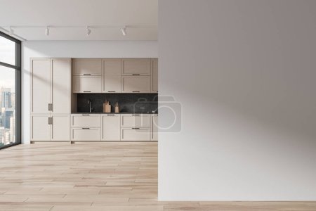 Foto de Interior de la cocina moderna con paredes blancas, suelo de madera, cómodos armarios de madera y armarios con cocina empotrada y fregadero y pared de espacio de copia a la derecha. renderizado 3d - Imagen libre de derechos