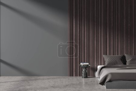 Foto de Interior del dormitorio del hotel de lujo oscuro con cama y mesita de noche, suelo de hormigón gris. Dormitorio con decoración minimalista y pared de espacio de copia de maqueta. Renderizado 3D - Imagen libre de derechos