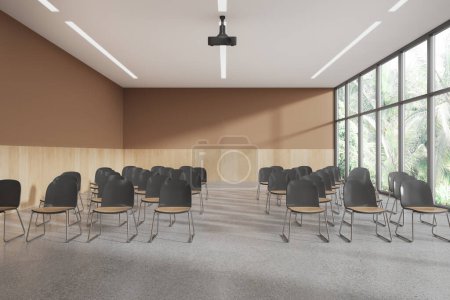 Photo for Beige modern class room interior with armchairs in row, projector on the ceiling and panoramic window on tropics. Training or meeting space with stylish design. 3D rendering - Royalty Free Image