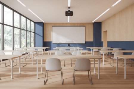Photo for Interior of modern classroom with blue and wooden walls, wooden floor, rows of desks with white chairs and mock up projection screen. 3d rendering - Royalty Free Image