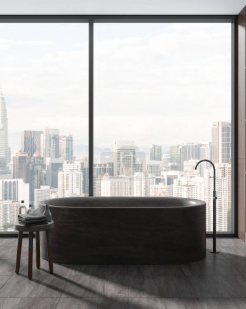 Foto de Interior del baño del hotel de lujo con bañera de piedra gris y mesa auxiliar, mezclador montado y accesorios de baño. Zona de spa cerca de ventana panorámica de los rascacielos Kuala Lumpur. Renderizado 3D - Imagen libre de derechos