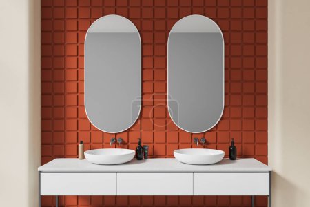 Téléchargez les photos : Intérieur salle de bain carrelage orange avec double évier et miroirs ovales, vanité blanche avec accessoires minimalistes. Espace de baignade dans un appartement contemporain moderne. rendu 3D - en image libre de droit