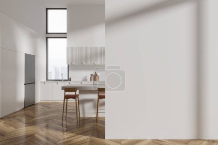 Photo for Interior of modern kitchen with white walls, wooden floor, white cupboards and cabinets, big refrigerator and cozy white island with stools. Copy space wall on the right. 3d rendering - Royalty Free Image