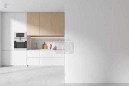 Foto de Interior de la cocina del hogar blanco con un elegante diseño de gabinete, lavabo con horno y utensilios de cocina en el mostrador. Espacio de cocción con una partición de pared de espacio de copia simulada. Renderizado 3D - Imagen libre de derechos