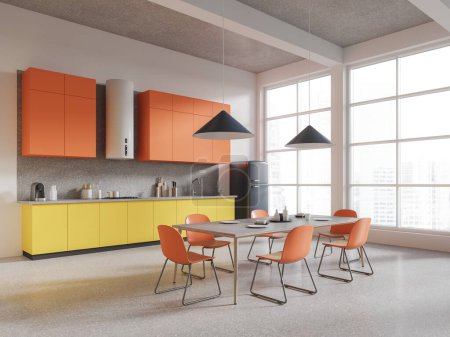 Photo for Corner of modern kitchen with white walls, concrete floor, orange cupboards, yellow cabinets with built in sink and cooker and long dining table with orange chairs. 3d rendering - Royalty Free Image