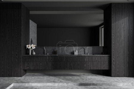 Téléchargez les photos : Intérieur de salle de bain élégante avec des murs en bois gris et foncé, sol en béton et confortable double lavabo avec grand miroir suspendu au-dessus. Rendu 3d - en image libre de droit