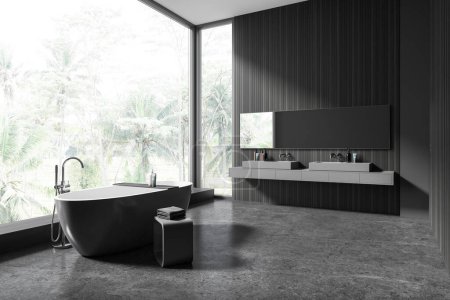 Photo for Corner of stylish bathroom with gray and dark wooden walls, concrete floor, comfortable gray bathtub standing near panoramic window and double sink with long mirror. 3d rendering - Royalty Free Image