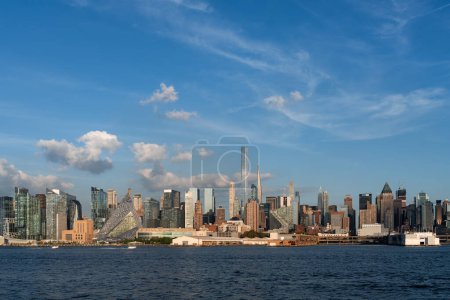 Photo for New York skyscrapers and Hudson River with clouds, waterfront and office buildings, financial world center. Manhattan midtown west skyline and business company - Royalty Free Image