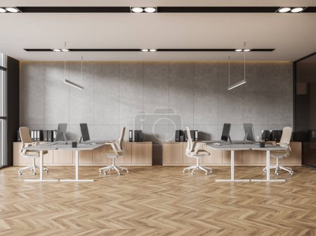 Foto de Elegante interior de madera coworking con escritorio pc en mesa compartida, muebles en fila en piso de madera dura. Espacio de trabajo con aparador y documentos. Renderizado 3D - Imagen libre de derechos
