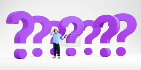 Photo for Pensive kid with smartphone, full length standing near large purple question marks set in row on light background. Concept of education, problem, search, idea, doubt or solution - Royalty Free Image