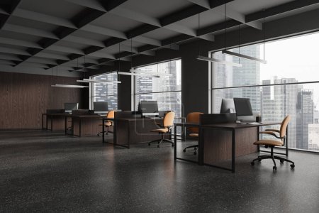 Photo for Stylish coworking interior with pc computers on work table in row, side view grey granite floor. Minimalist work corner with panoramic window on Bangkok skyscrapers. 3D rendering - Royalty Free Image