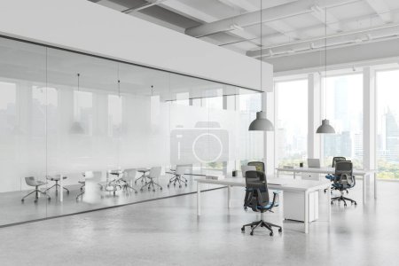 Photo for White cozy office loft interior with coworking and conference corner, side view laptop computers on table in row. Glass meeting room and panoramic window on Bangkok skyscrapers. 3D rendering - Royalty Free Image