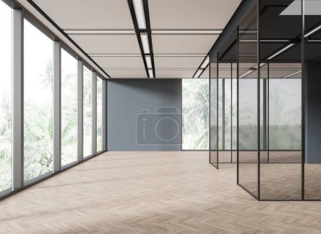 Téléchargez les photos : Intérieur de élégant hall de bureau vide avec murs gris et verre, sol en bois et fenêtre panoramique avec vue tropicale. Rendu 3d - en image libre de droit