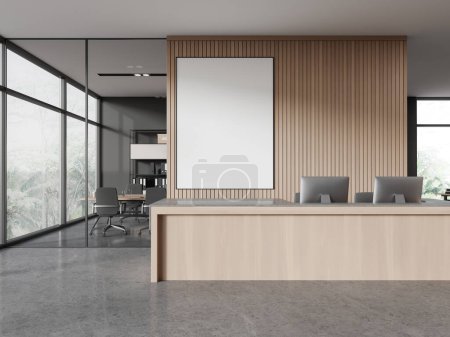 Photo for Interior of modern office hall with gray and wooden walls, concrete floor and comfortable wooden reception desk with computers and mock up poster behind it. 3d rendering - Royalty Free Image