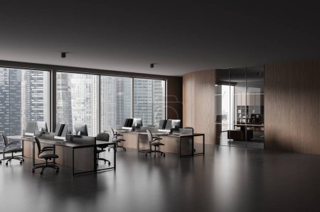 Photo for Dark office interior with coworking corner, side view pc desktop on tables in row. Glass meeting room with panoramic window on Singapore skyscrapers. 3D rendering - Royalty Free Image