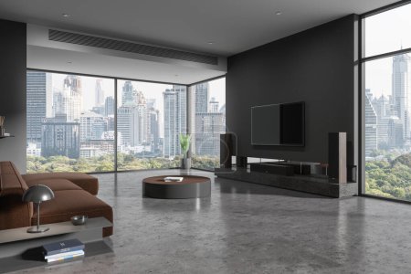 Foto de Esquina de la elegante sala de estar con paredes grises, suelo de hormigón, acogedor sofá marrón de pie cerca de la mesa de café redonda y televisor colgando de la pared. renderizado 3d - Imagen libre de derechos