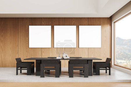 Photo for Wooden home living room interior with dining table and chairs, eating space on podium, hardwood floor. Panoramic window on countryside. Three mock up blank posters in row. 3D rendering - Royalty Free Image