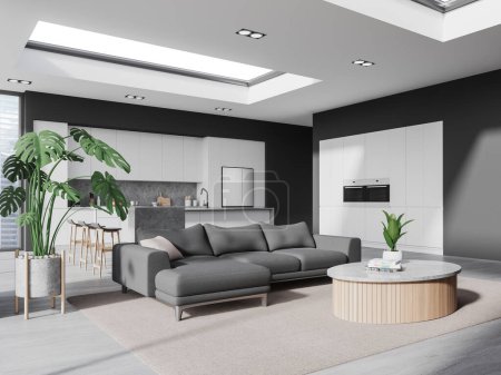 Photo for Corner of stylish living room with gray walls, concrete floor, cozy gray sofa standing near round coffee table and comfortable kitchen with island, fridge and white cabinets. 3d rendering - Royalty Free Image