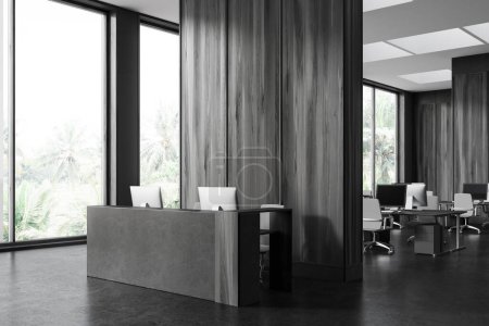Photo for Corner of stylish office hall with gray and wooden walls, concrete floor and comfortable gray and wooden reception counter with two computers. 3d rendering - Royalty Free Image