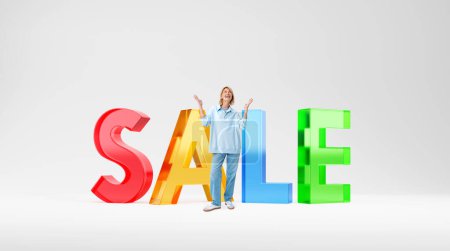 Photo for Smiling woman full length with raised hands, standing near glass large colorful sale letters. Smiling person looking up happy about a good offer. Concept of bargain, good offer and low price - Royalty Free Image