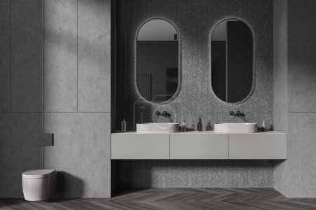 Photo for Interior of stylish bathroom with gray walls, wooden floor, comfortable double sink with two oval mirrors and toilet bowl. 3d rendering - Royalty Free Image