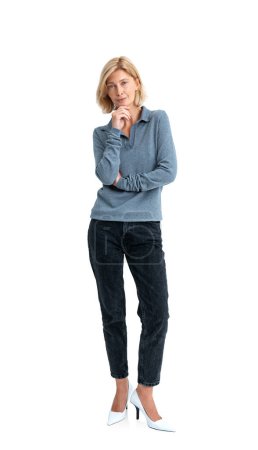 Photo for Thoughtful blonde woman with hand on chin, pensive person full length. Making up plan or idea, isolated over white background. Concept of opinion, choice and decision - Royalty Free Image
