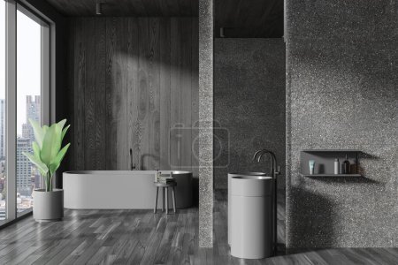 Foto de Interior de elegante cuarto de baño con paredes grises y de madera, suelo de madera, acogedora bañera gris y fregadero redondo con espejo vertical. renderizado 3d - Imagen libre de derechos