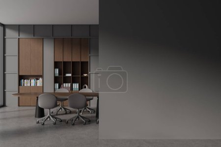 Téléchargez les photos : Intérieur sombre de la salle d'affaires avec table de réunion, sol béton gris. Design de lieu de travail moderne avec des meubles minimalistes, cloison de mur d'espace de copie maquette. rendu 3D - en image libre de droit