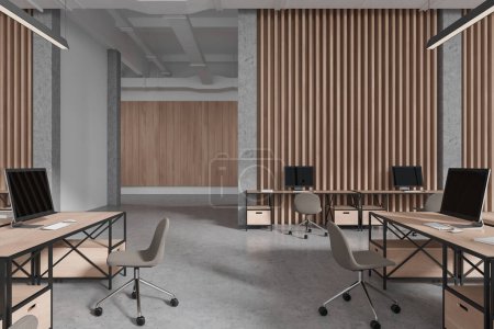 Foto de Coworking interior con monitores de PC en el escritorio, sillas en el suelo de hormigón gris. Moderno lugar de trabajo de oficina con muebles minimalistas y pasillo. Renderizado 3D - Imagen libre de derechos