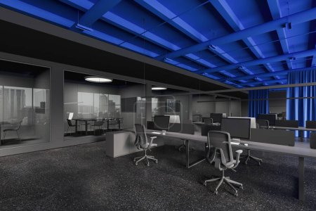 Photo for Dark office interior with coworking and pc computers on shared desk in row, side view blue curtain partition. Glass minimalist conference boxes with table and chairs. 3D rendering - Royalty Free Image