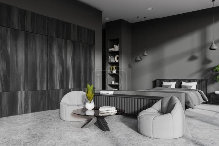 Foto de Dark home bedroom interior with bed and soft armchairs, side view coffee table with decoration on grey concrete floor. Elegant sleep and chill corner with wardrobe and shelf. 3D rendering - Imagen libre de derechos