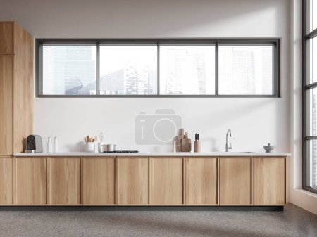 Téléchargez les photos : Modern home kitchen interior with sink and kitchenware, grey concrete floor. Stylish cooking cabinet in luxury apartment. Panoramic window on Singapore skyscrapers. 3D rendering - en image libre de droit