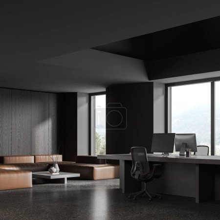 Téléchargez les photos : Corner view of dark business interior with armchairs and pc monitors, shared table and sofa near panoramic window on countryside. Modern workspace with minimalist design. 3D rendering - en image libre de droit