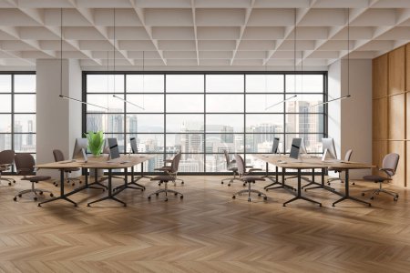 Photo for Modern coworking interior with armchairs and pc desktop, shared table on hardwood floor. Office business workspace and panoramic window on Kuala Lumpur skyscrapers. 3D rendering - Royalty Free Image