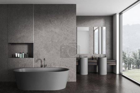 Téléchargez les photos : Dark hôtel salle de bain intérieure avec baignoire et étagère avec accessoires, cloison et double lavabo avec miroirs près de la fenêtre panoramique sur la campagne. rendu 3D - en image libre de droit
