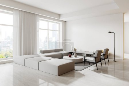 Foto de Esquina de la moderna sala de estar con paredes blancas, suelo de hormigón y cómodo sofá blanco y dos sillones de pie cerca de la mesa redonda. renderizado 3d - Imagen libre de derechos