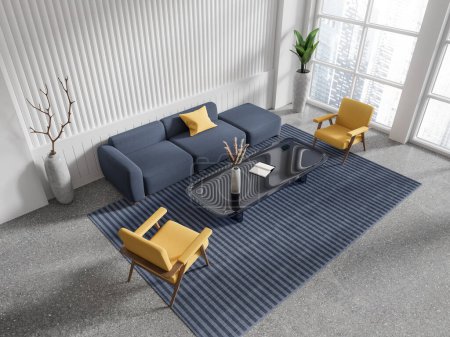 Foto de Vista superior del elegante interior de la habitación chill con sofá azul y sillones amarillos, mesa de centro con decoración en alfombra, suelo de granito gris. Ventana panorámica de los rascacielos de Singapur. Renderizado 3D - Imagen libre de derechos