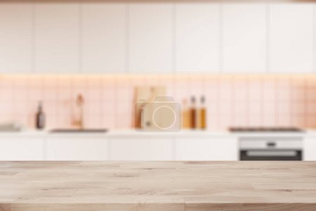 Foto de Mesa de exposición de productos de madera ubicada en una elegante cocina borrosa con paredes blancas y armarios blancos con horno incorporado. renderizado 3d - Imagen libre de derechos