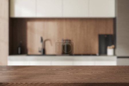 Téléchargez les photos : Table en bois vide sur fond flou de cuisine intérieure élégante, espace de cuisson avec ustensiles de cuisine et cuisinière. Maquette de l'espace de copie pour l'affichage du produit. rendu 3D - en image libre de droit